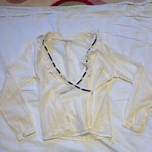 Chic White Ruffled Blouse with Black Trim